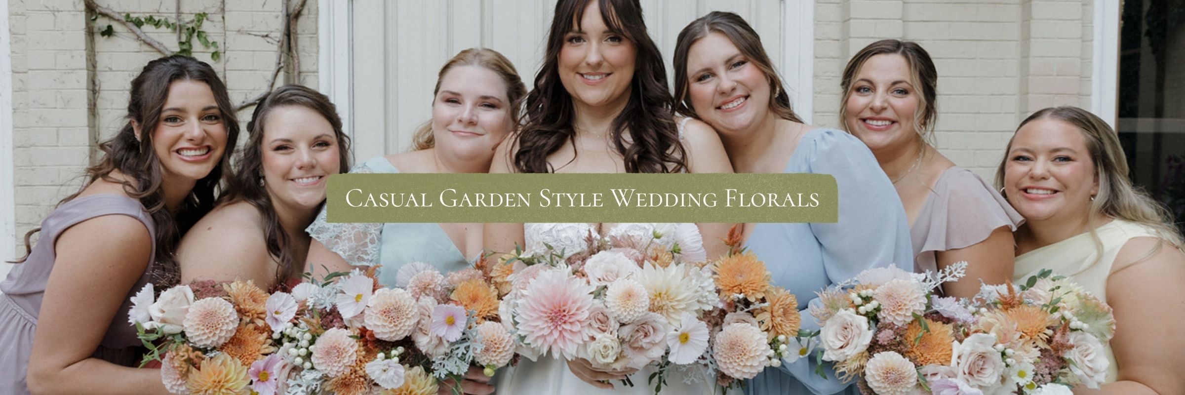 Bride and five bridesmaids holding peach and cream dahlia bouquets with text reading Casual Garden Style Wedding Florals